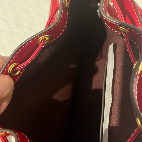 Tory Burch Hazelnut/Tory Red. Price is firm. 
T MONOGRAM JACQUARD BUCKET BAG - Picture 4 of 13